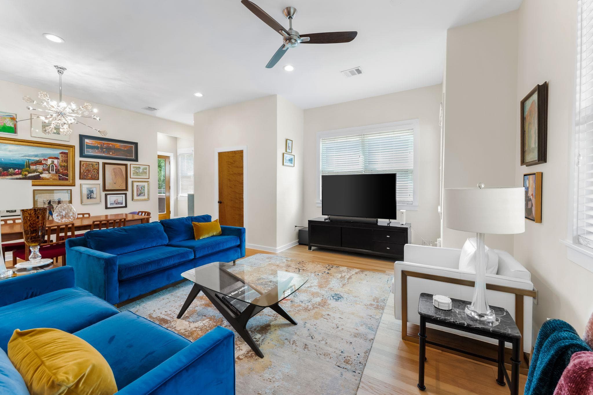 Living room featuring suspended lighting, light w