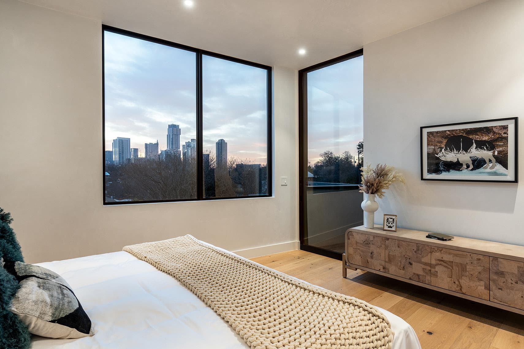 Floor-to-ceiling windows offer captivating city v