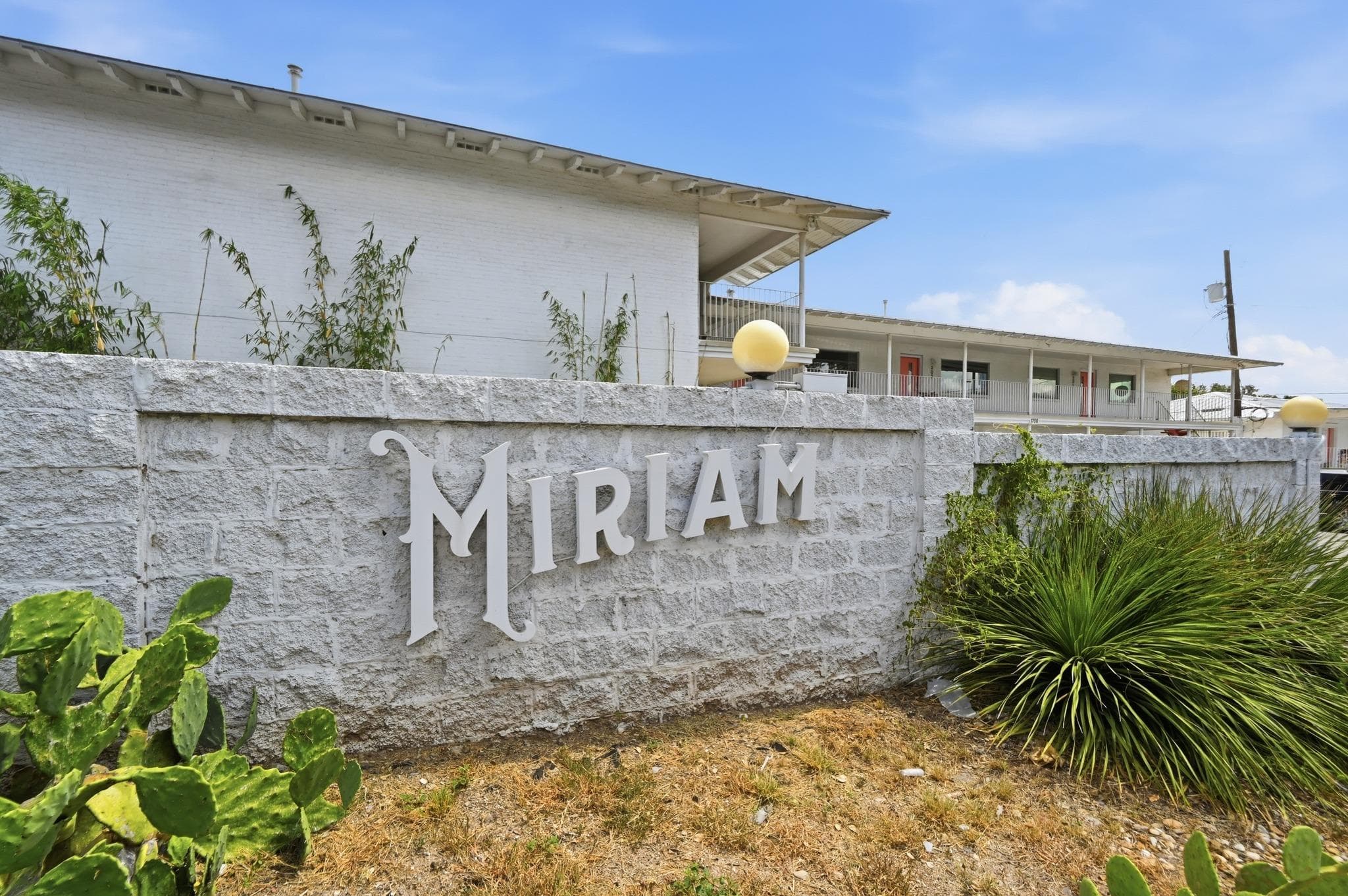 A welcoming stone wall with "Miriam" inscribed ma