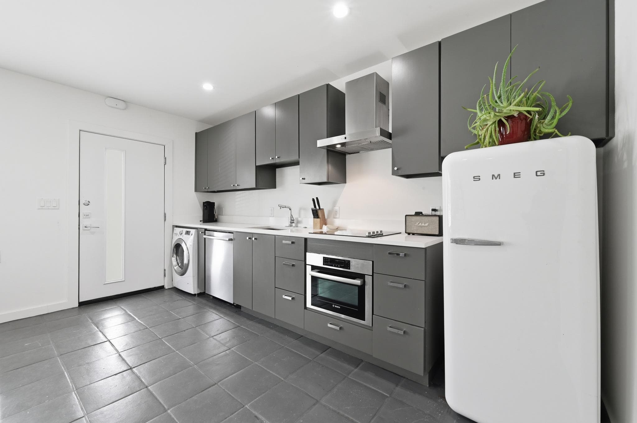 A sleek, contemporary kitchen with integrated app