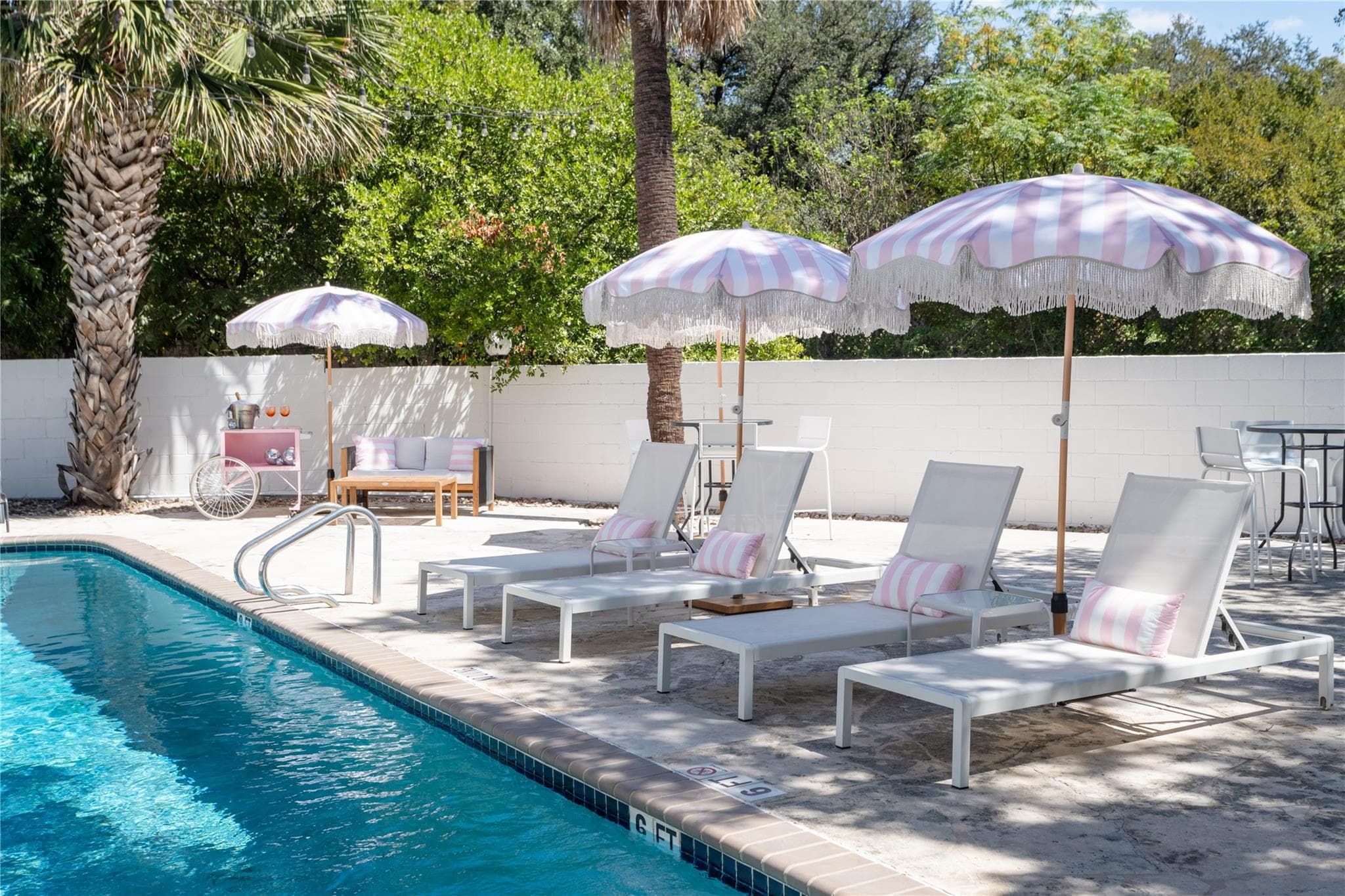 A tranquil poolside retreat with chic umbrellas a
