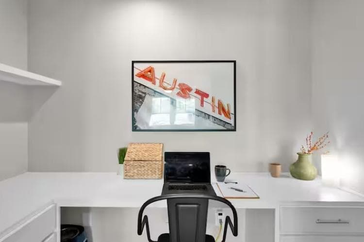 Office space featuring built in desk