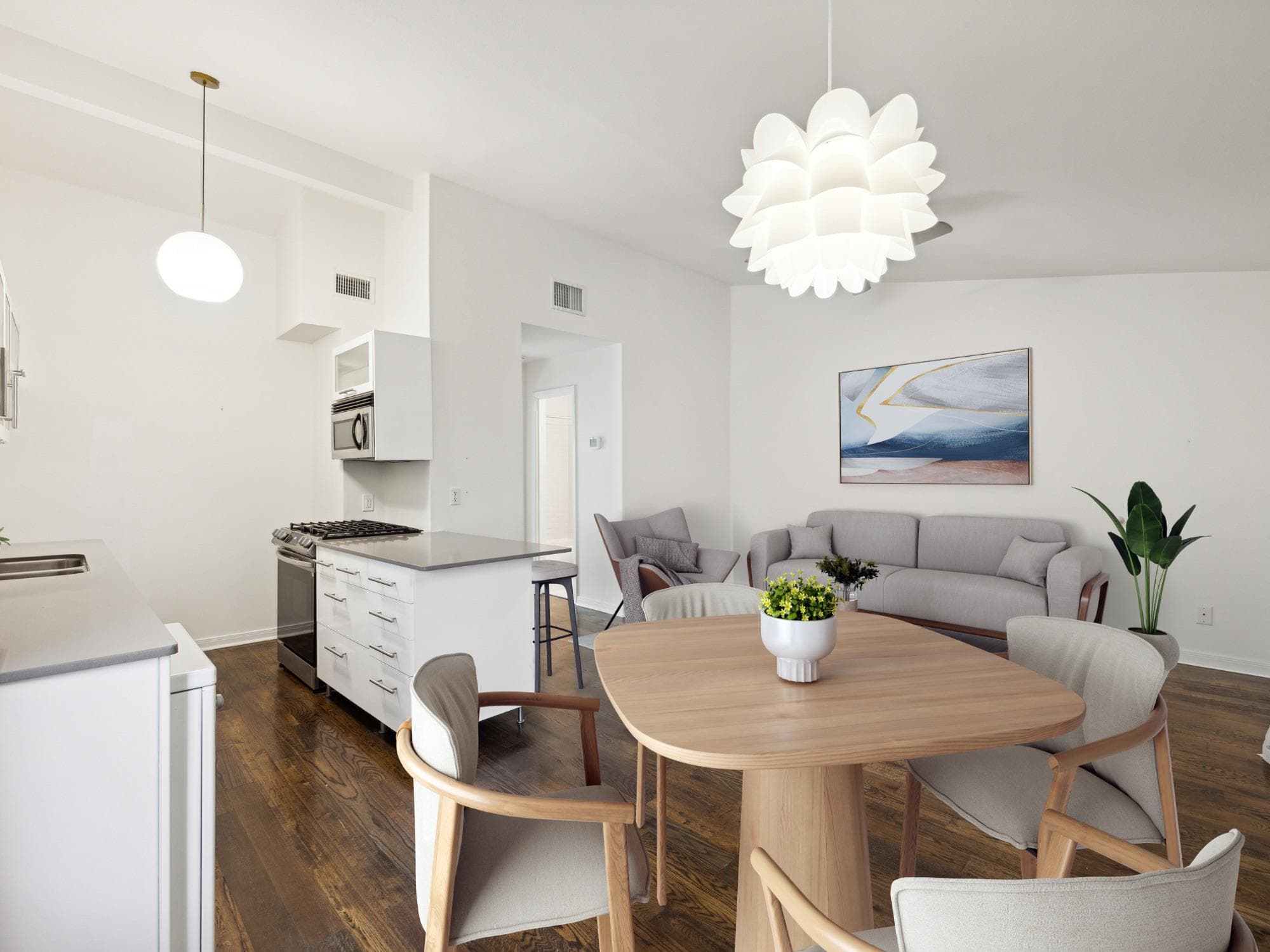 Open-concept living space featuring hardwood-fini
