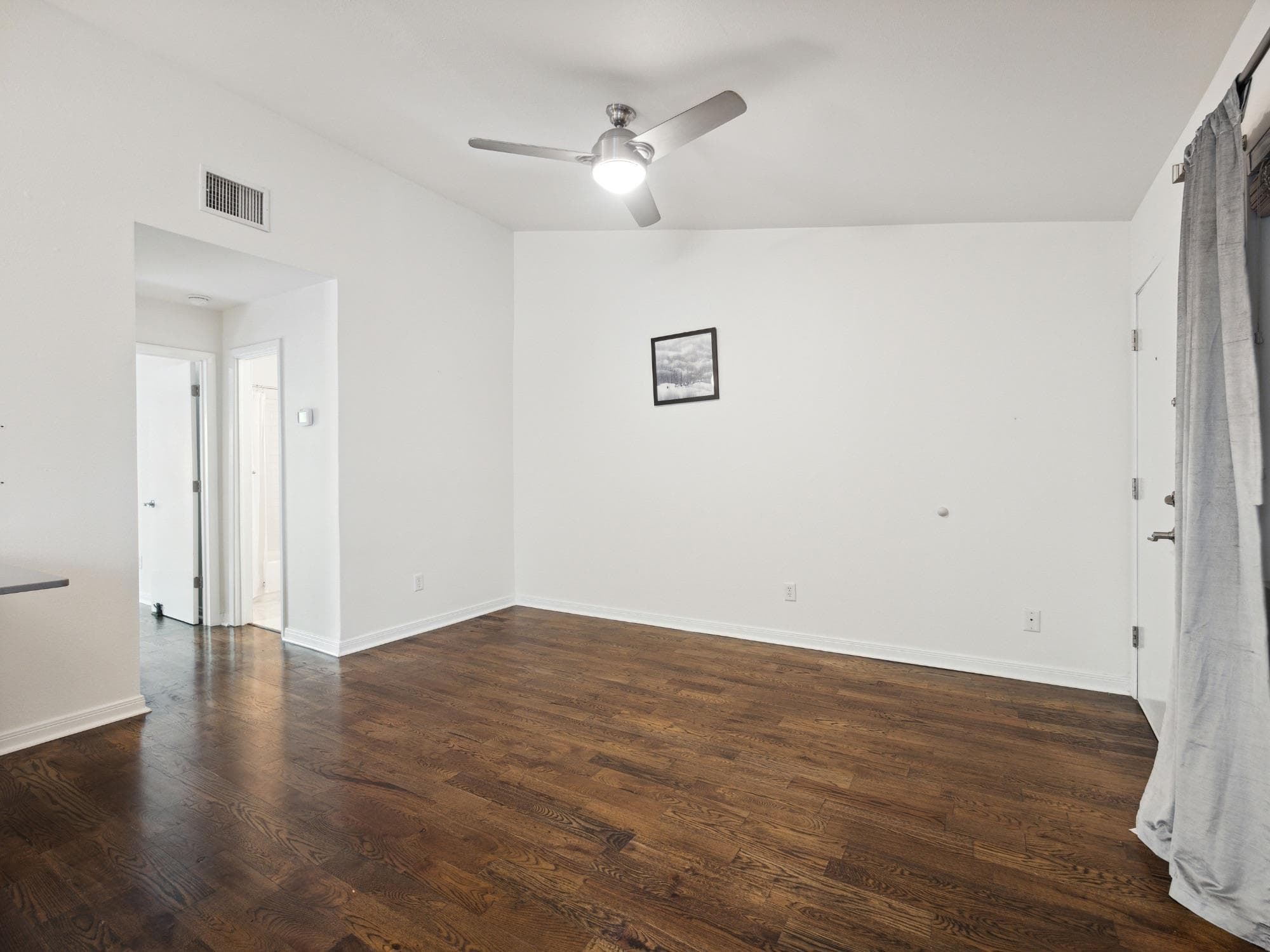 Expansive living area featuring rich wood-finish