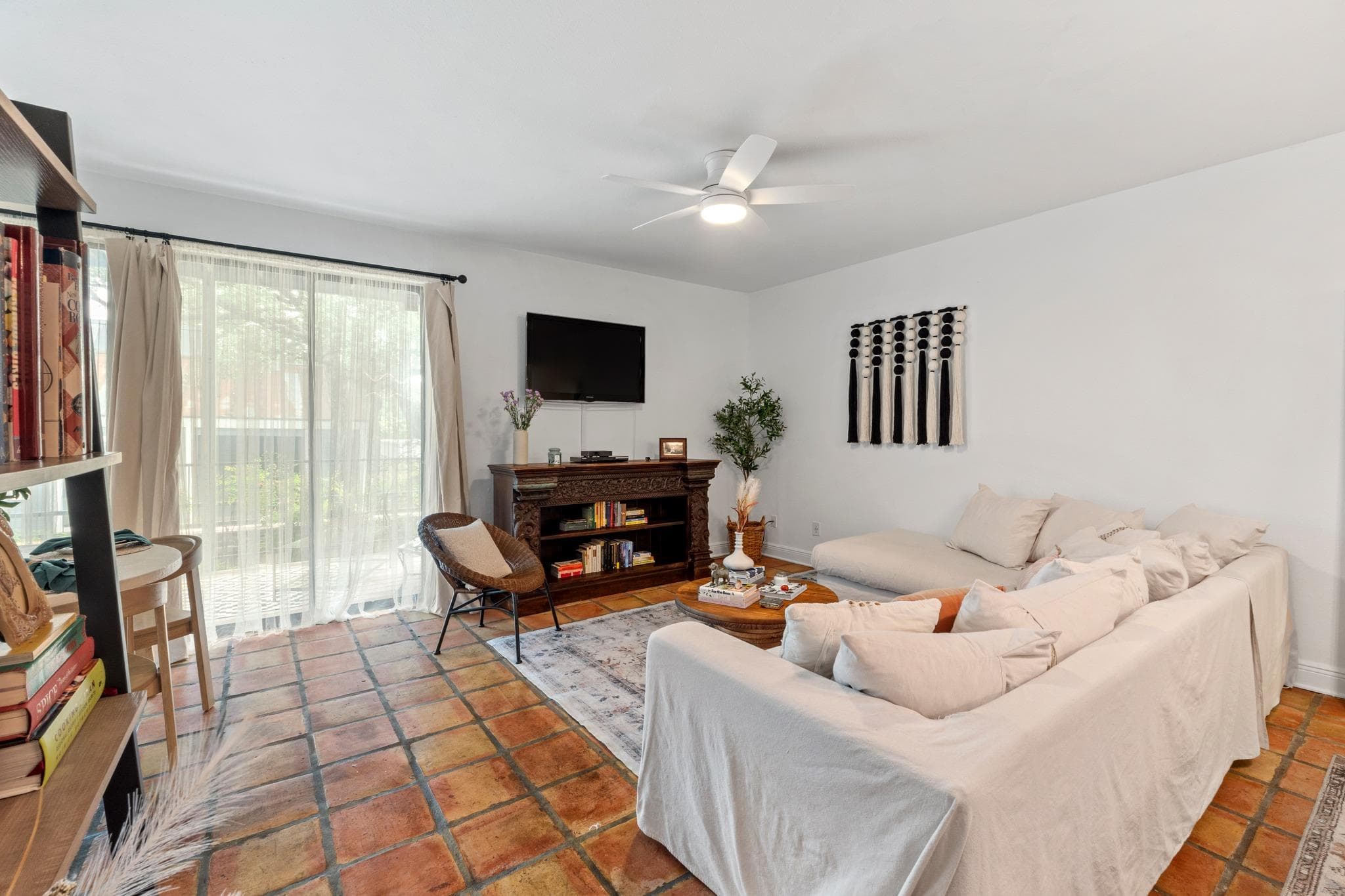 Living area featuring terra cotta tile flooring,