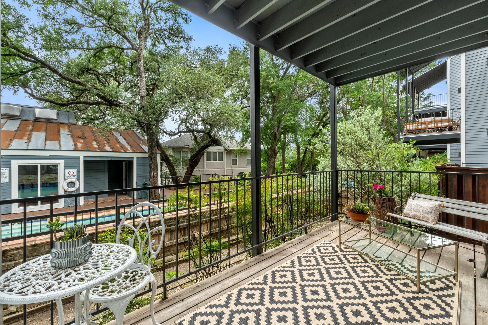 Private balcony featuring wood-finish flooring, b