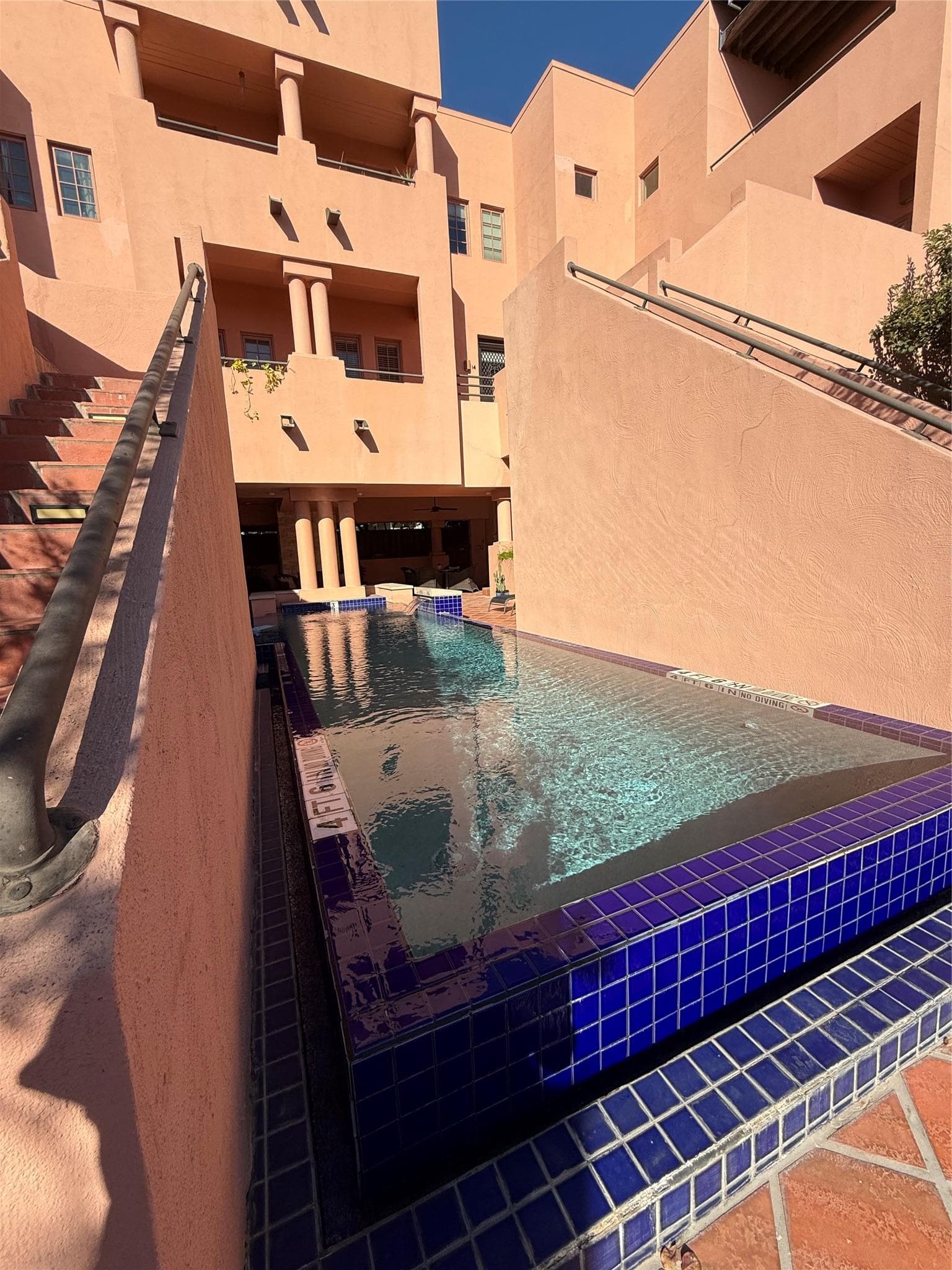 Community pool featuring a balcony