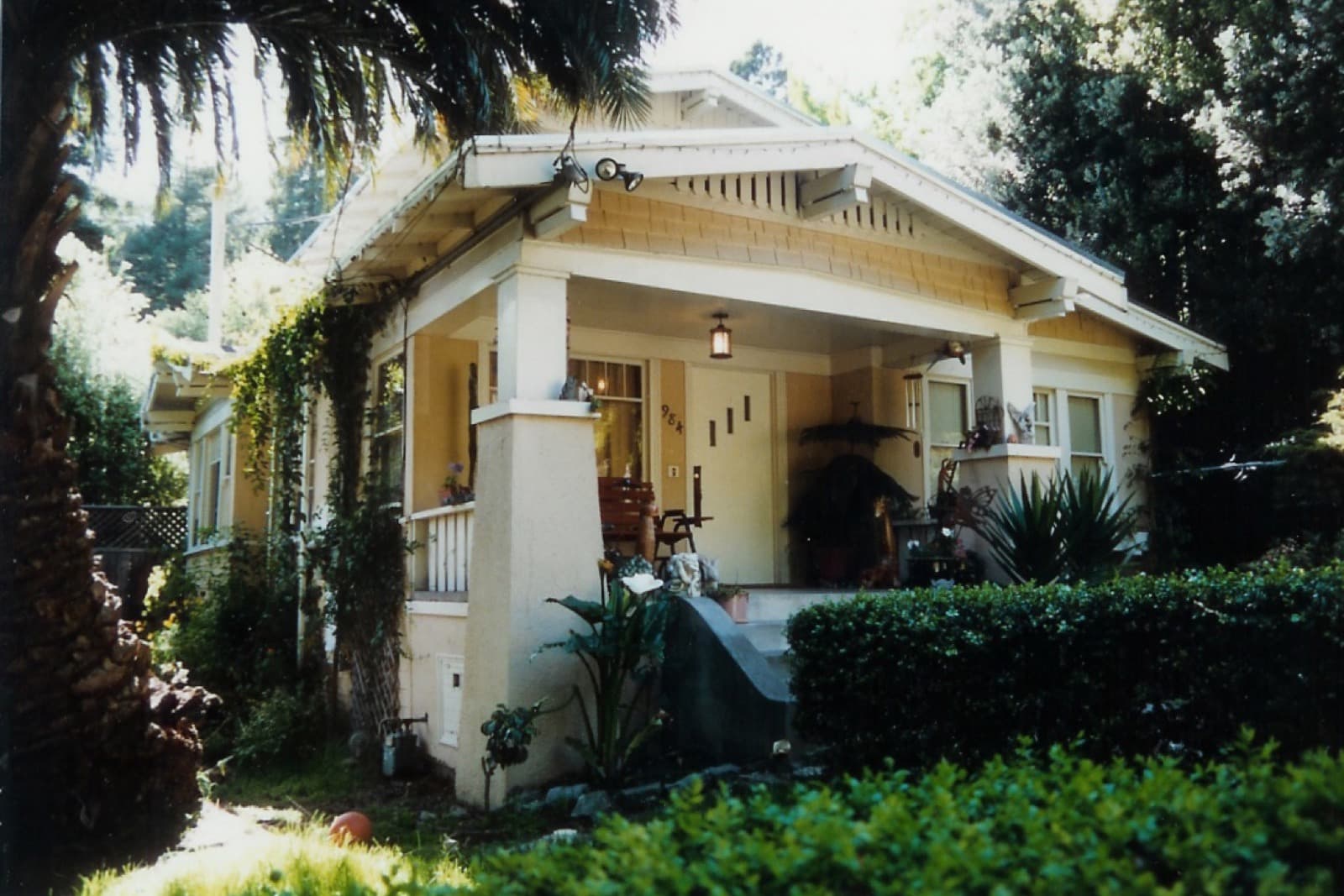 Architectural detail of a historic Clarksville porch with board-and-batten siding and brass hardware